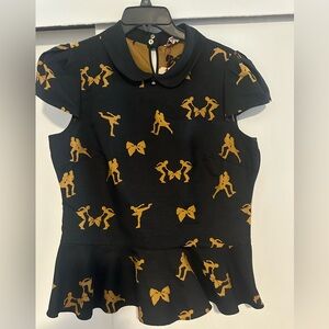 Sexy blouse, black and gold color to causal or evening wear.